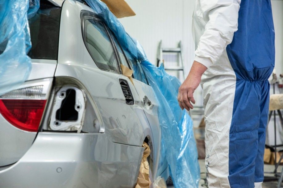 Car Being Repaired in a Garage — Jay's Tint in Smithfield, QLD