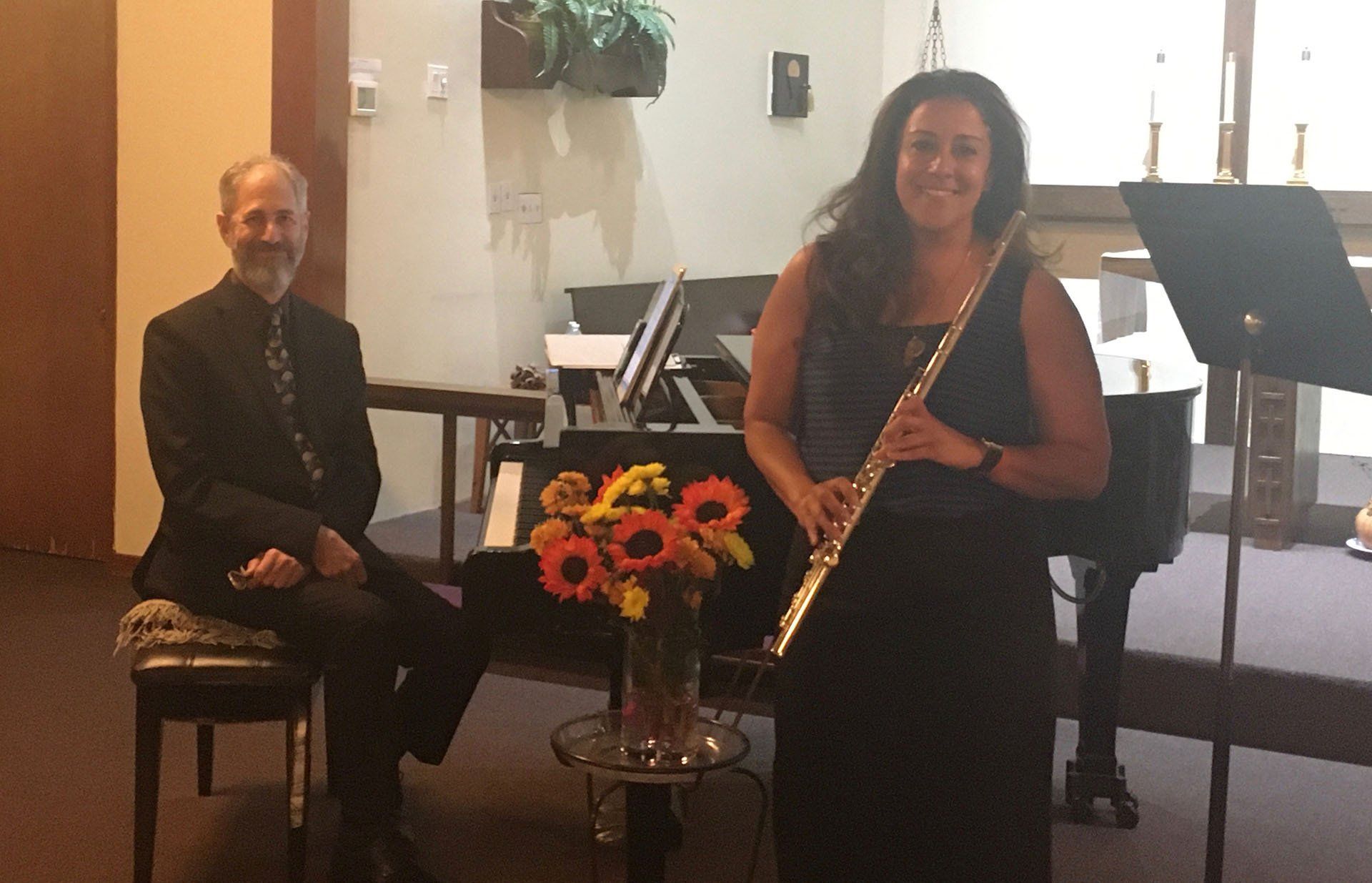 Old Man and a Woman Holding a Flute — Costa Mesa, CA — New Day Music Studio
