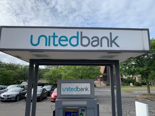 Before People's United Bank Sign