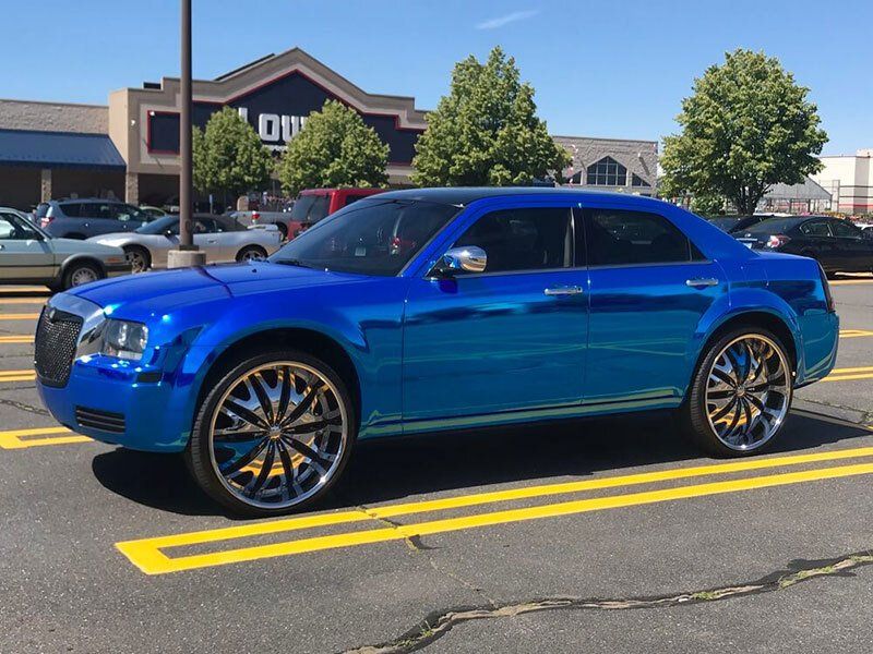 blue Cadillac vehicle wrap