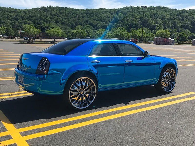 blue cadillac rear view vehicle wrap