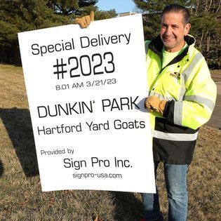 Owner pete rappoccio delivering the sign