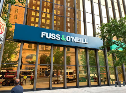 A building with a sign that says 'fuss & o'neill' on it