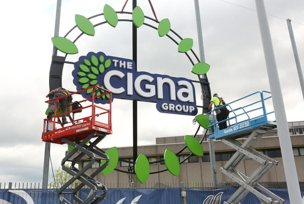 A sign that says the cigna group is being installed