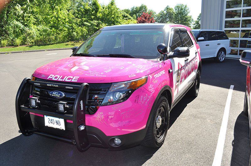 pink police car vehicle wrap