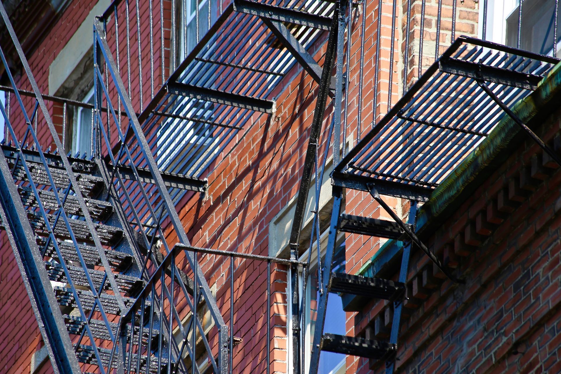 A fire escape on the side of a brick building