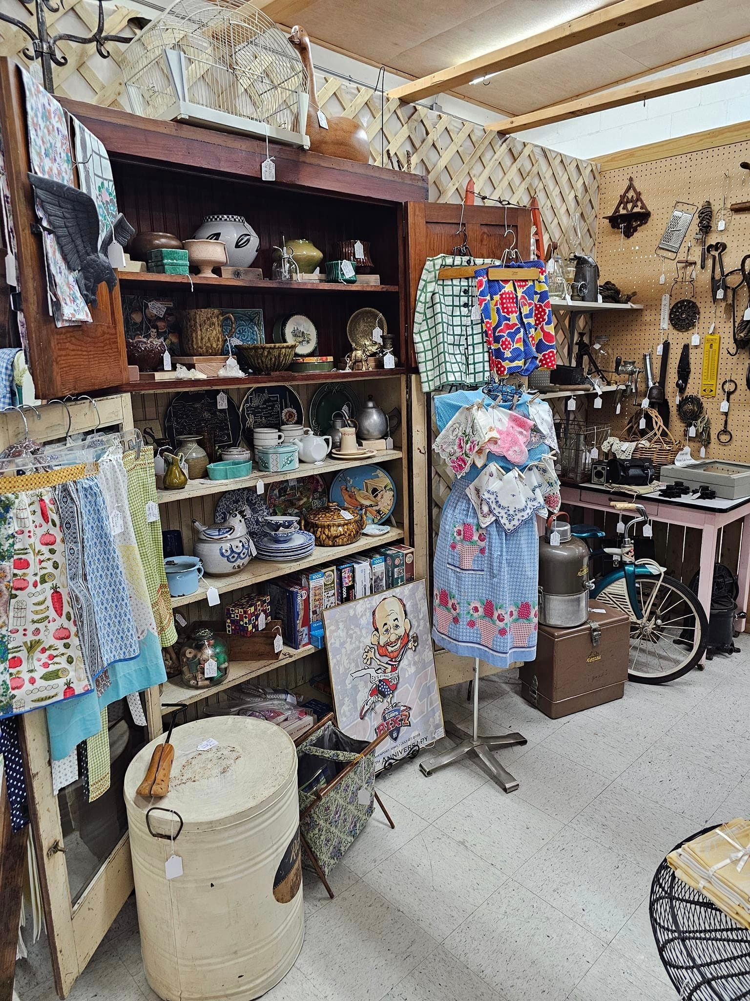 A room filled with lots of shelves and clothes on display.