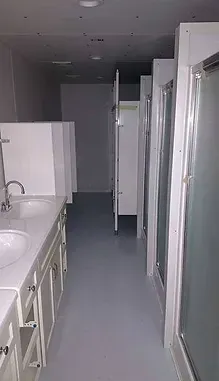 a bathroom with a sink and a shower stall .