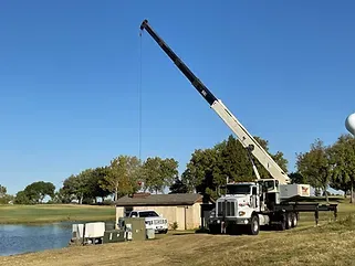 a large truck with a crane on top of it