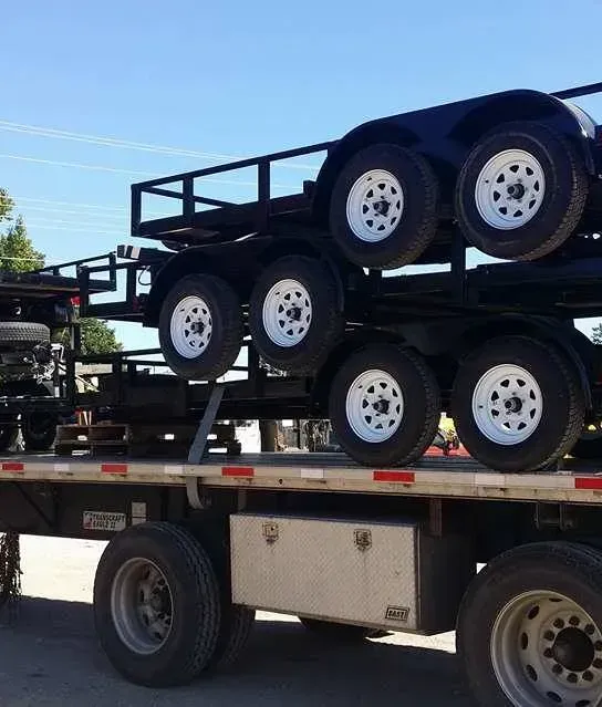 a trailer with a stack of trailers on top of it