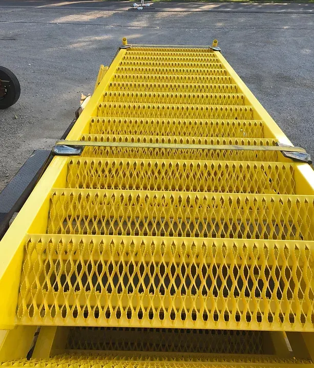 a yellow metal staircase is sitting on the ground