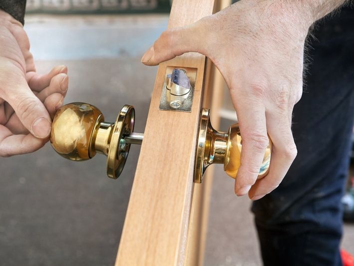 Locksmith Installing Door Lock — Colorado Springs, CO — Henley’s Key Service Inc.
