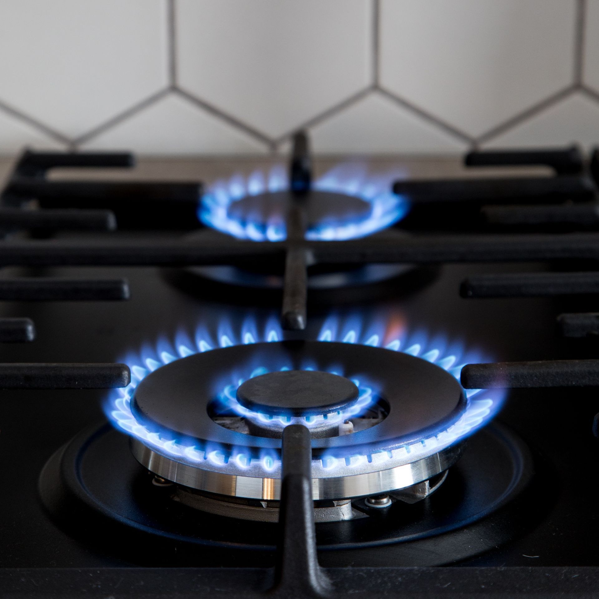 gas burner on black modern kitchen stove