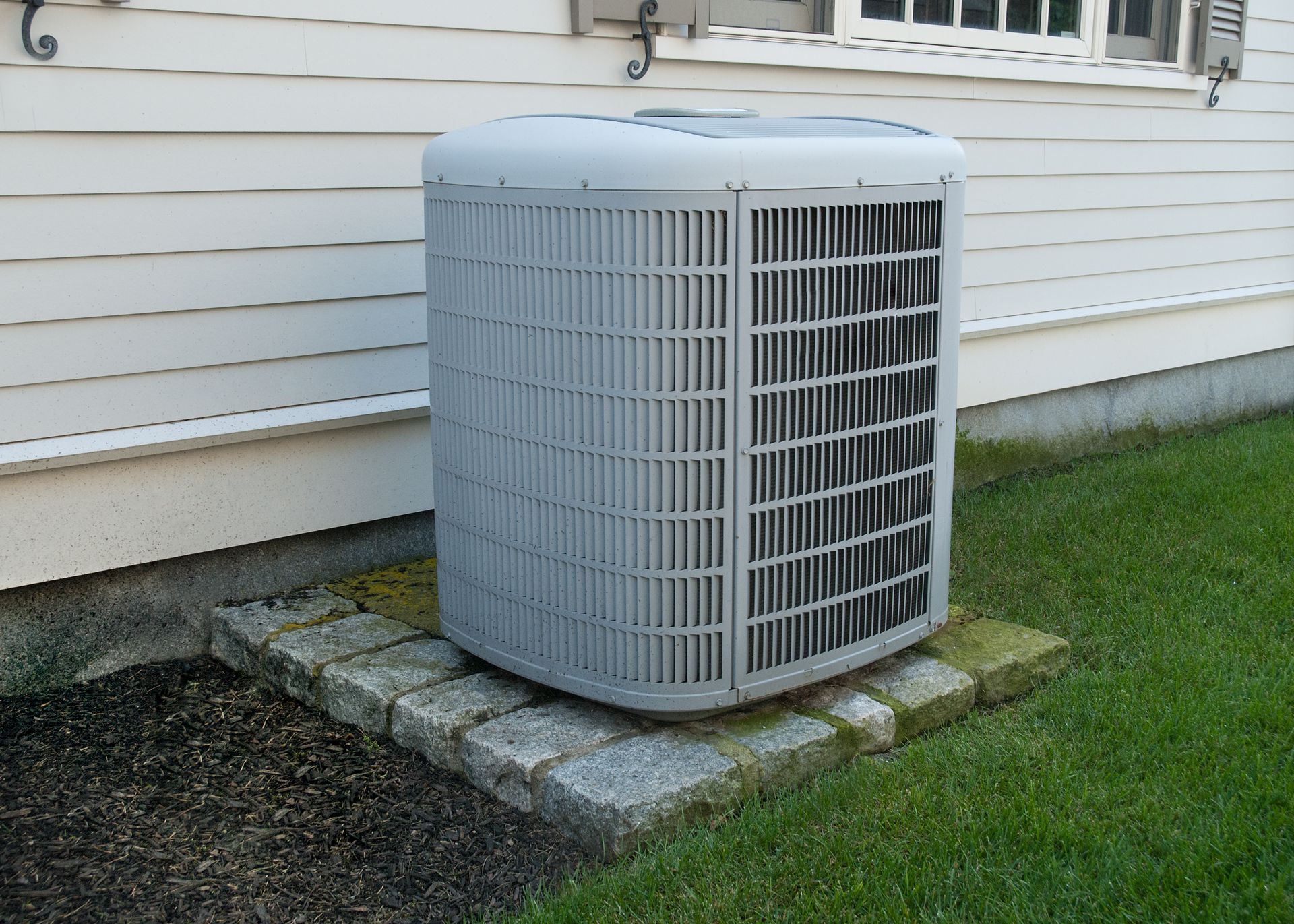 Air conditioning unit outside a house