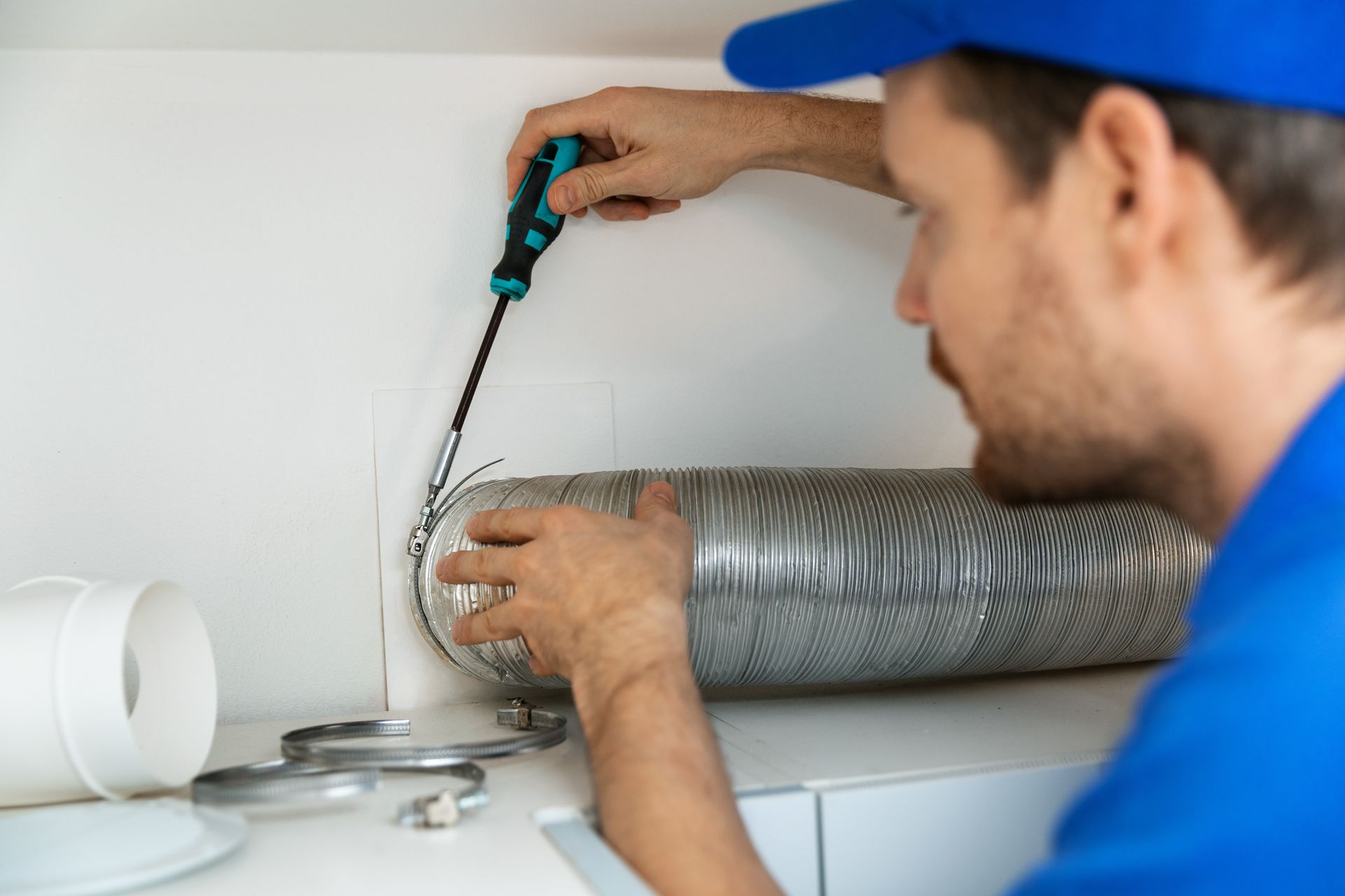 worker installing duct