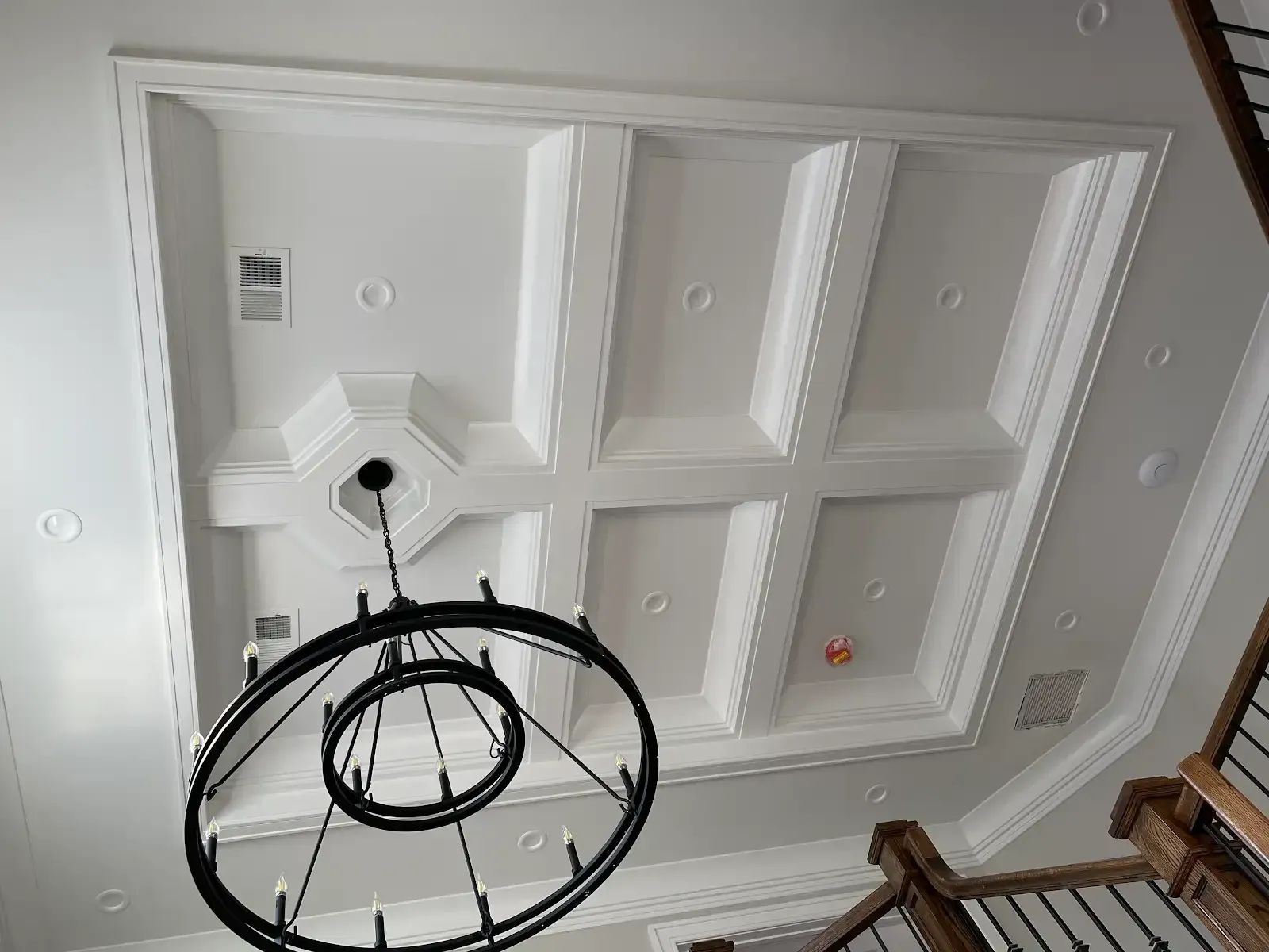 A chandelier is hanging from the ceiling of a room