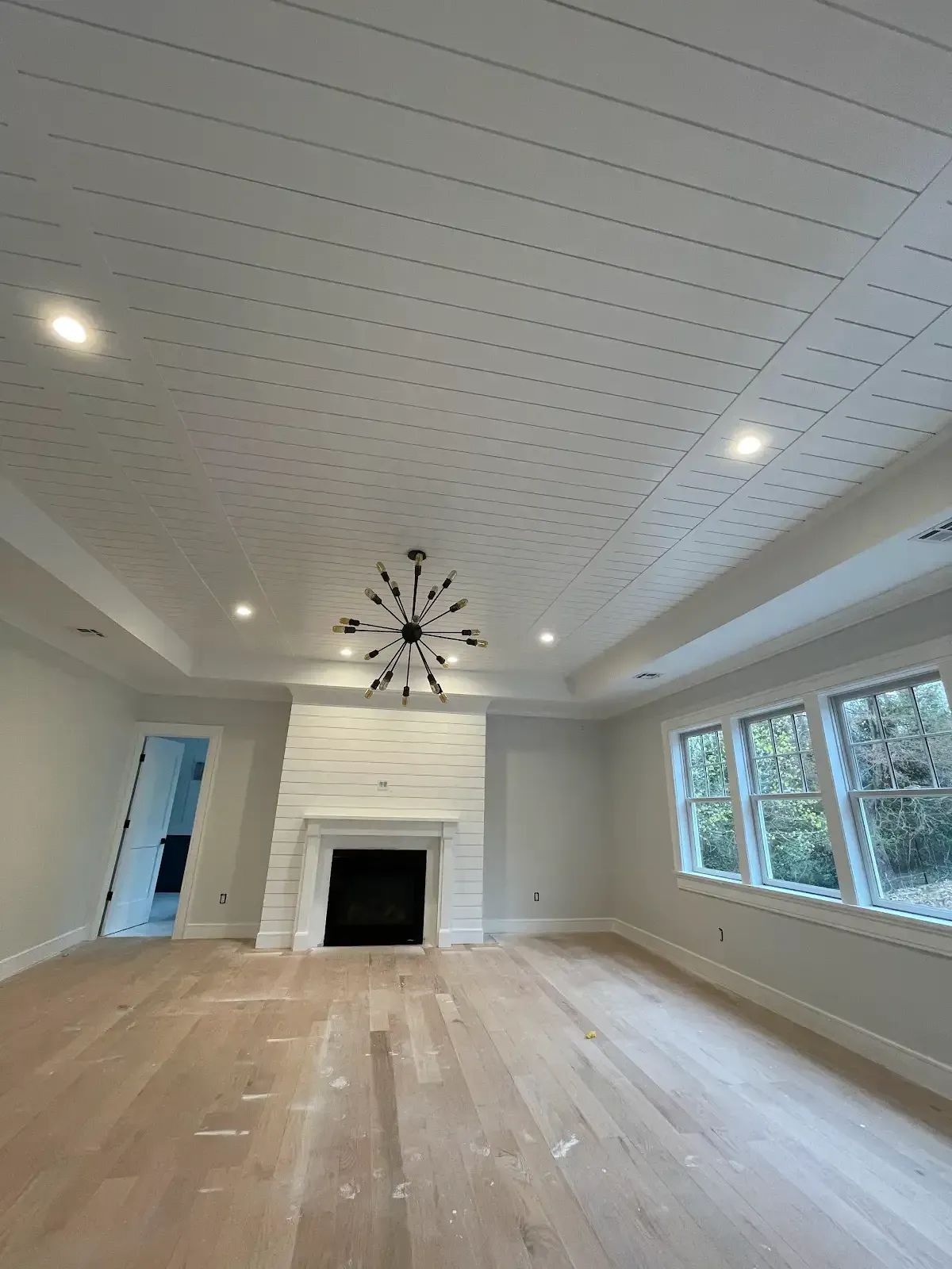 There is a fireplace in the middle of the room