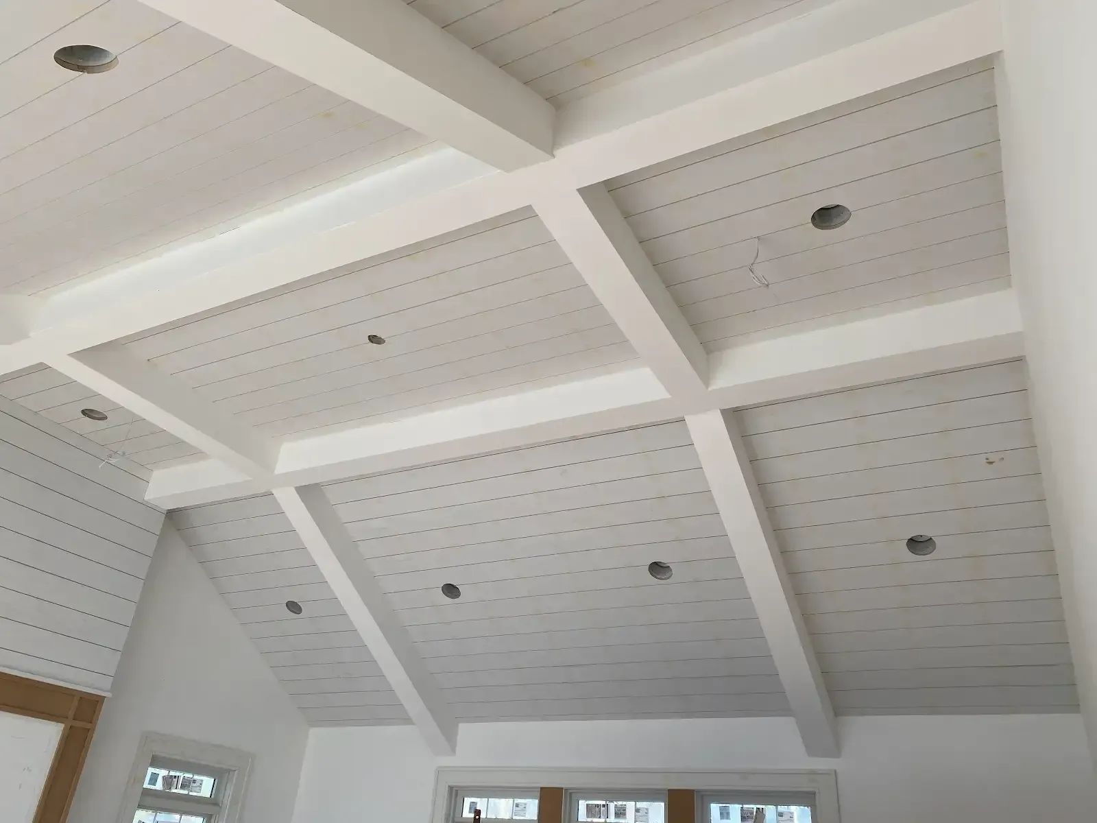 Looking up at a white ceiling in a room