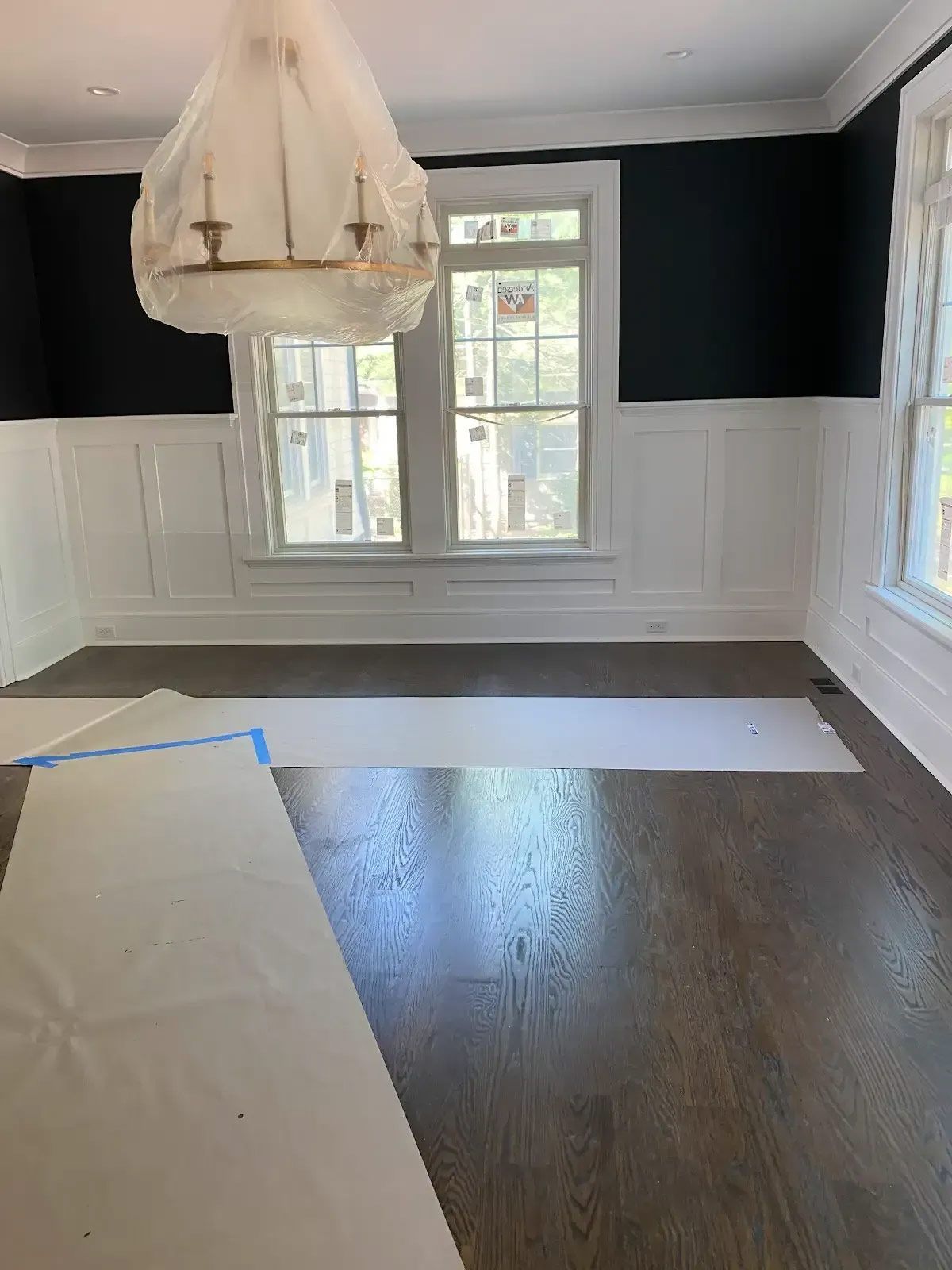 There is a chandelier in the middle of the room