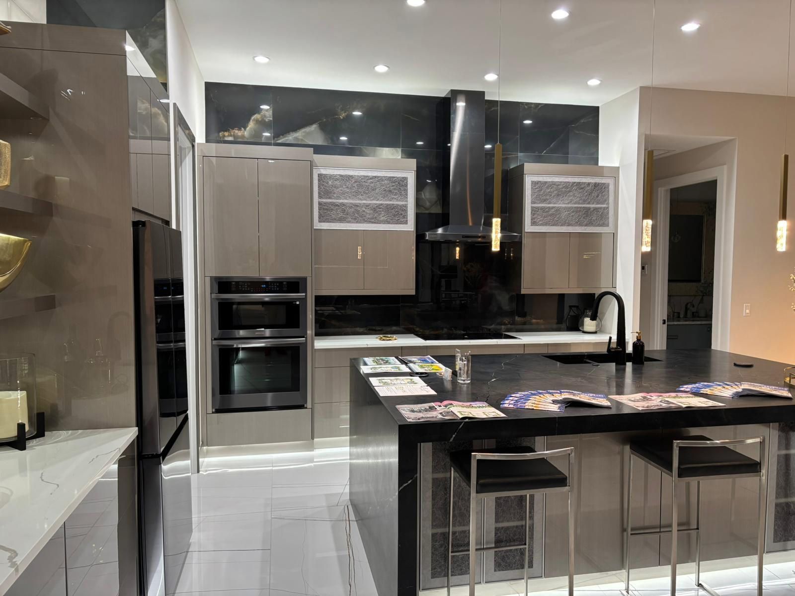 A kitchen with a large island and stools