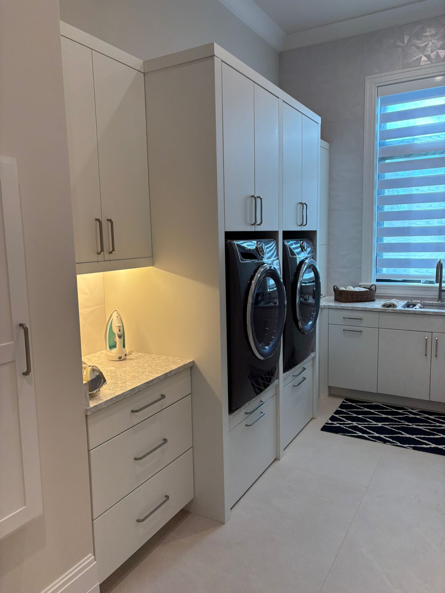 A laundry room with a washer and dryer in it