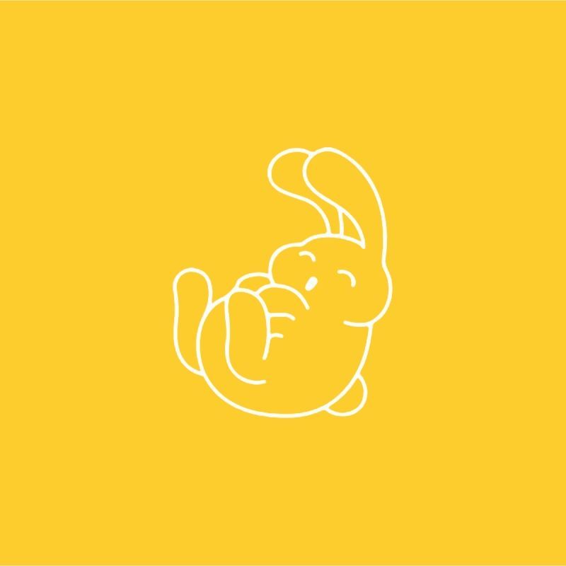 White outline of a playful rabbit on its back, arms raised, against a yellow background.