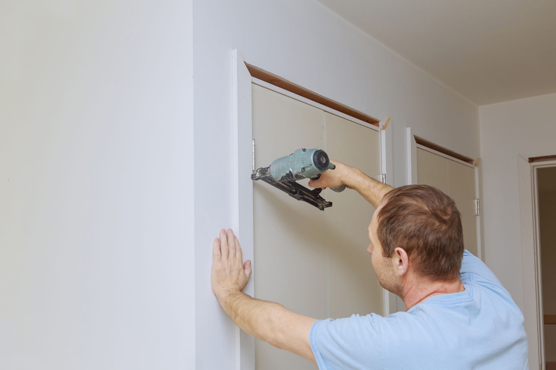 Carpenter installing molding