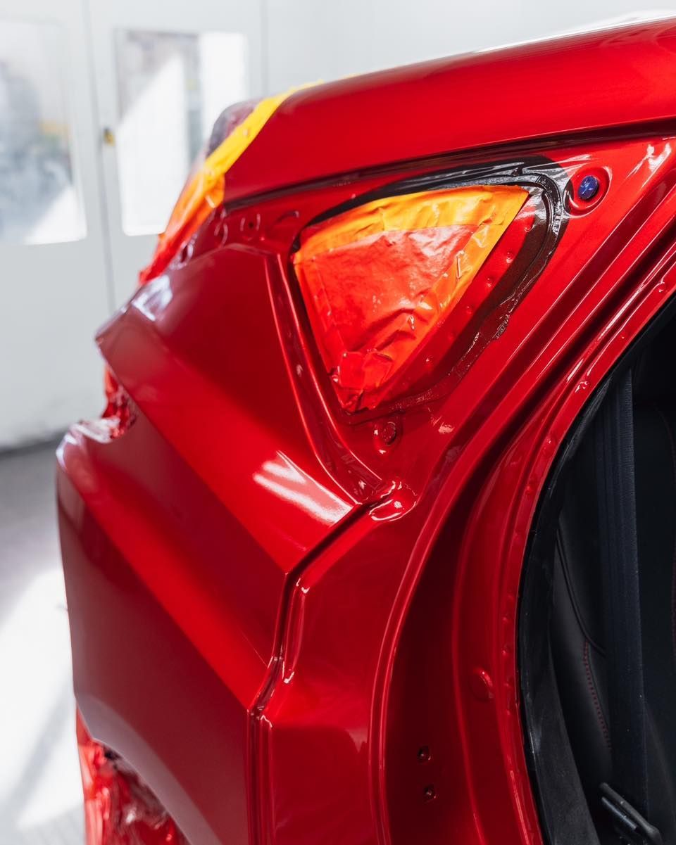 Close Up Of Rear Tail Light On Red Car | D&V Autobody Overland