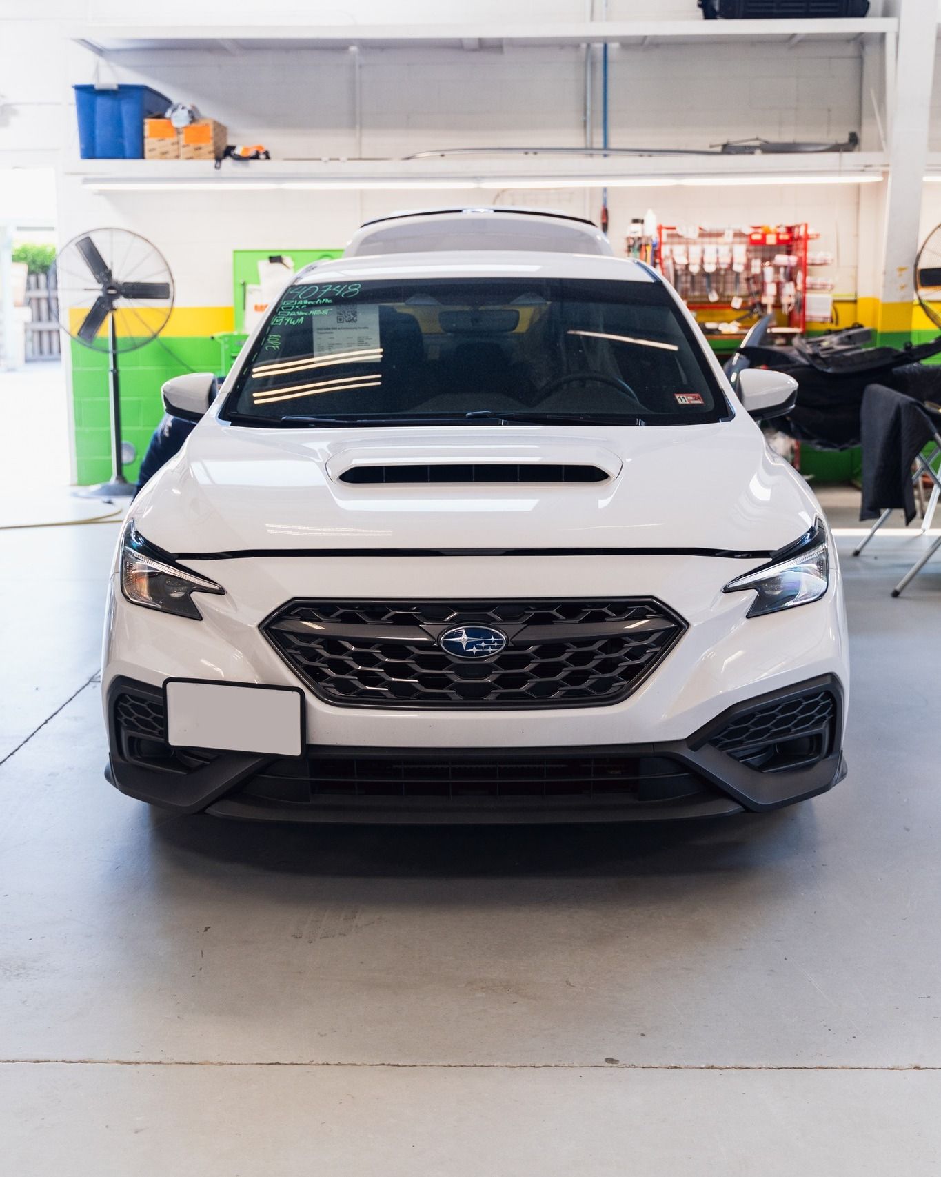 White SUV Front View Inside Auto Shop | D&V Autobody Overland