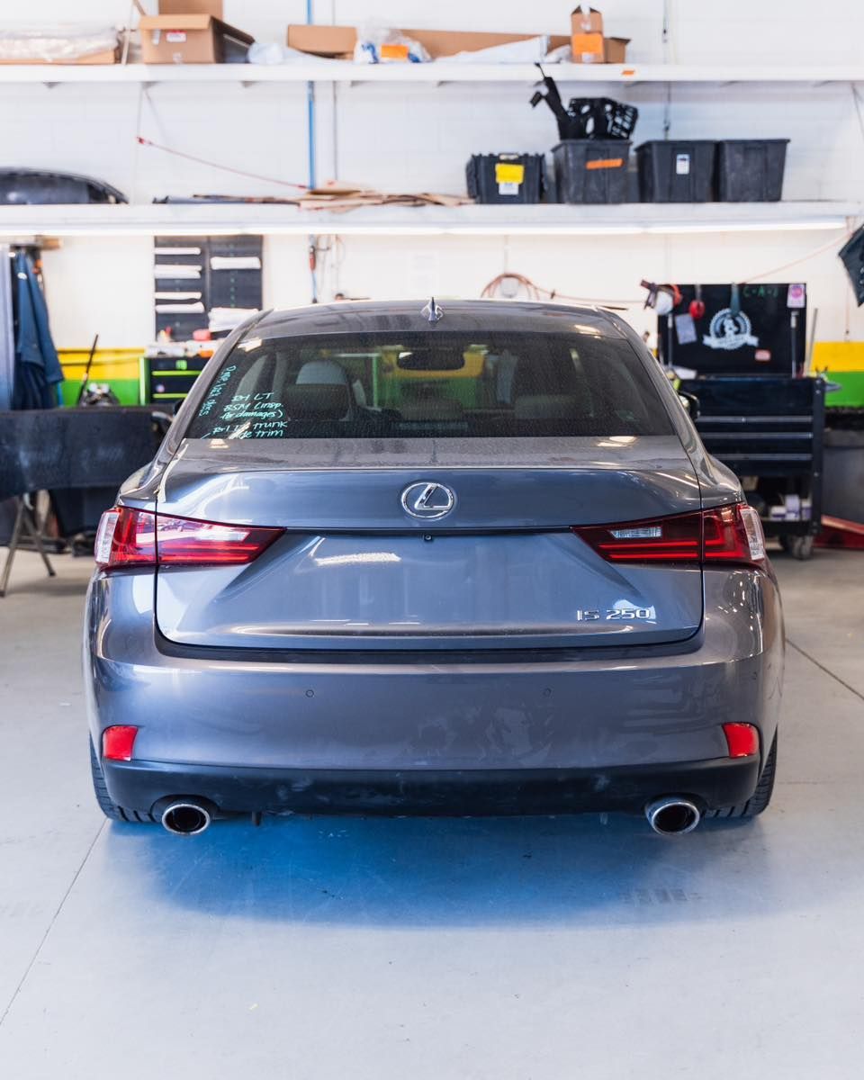Blue Sedan Rear View Inside Auto Body Shop | D&V Autobody Overland