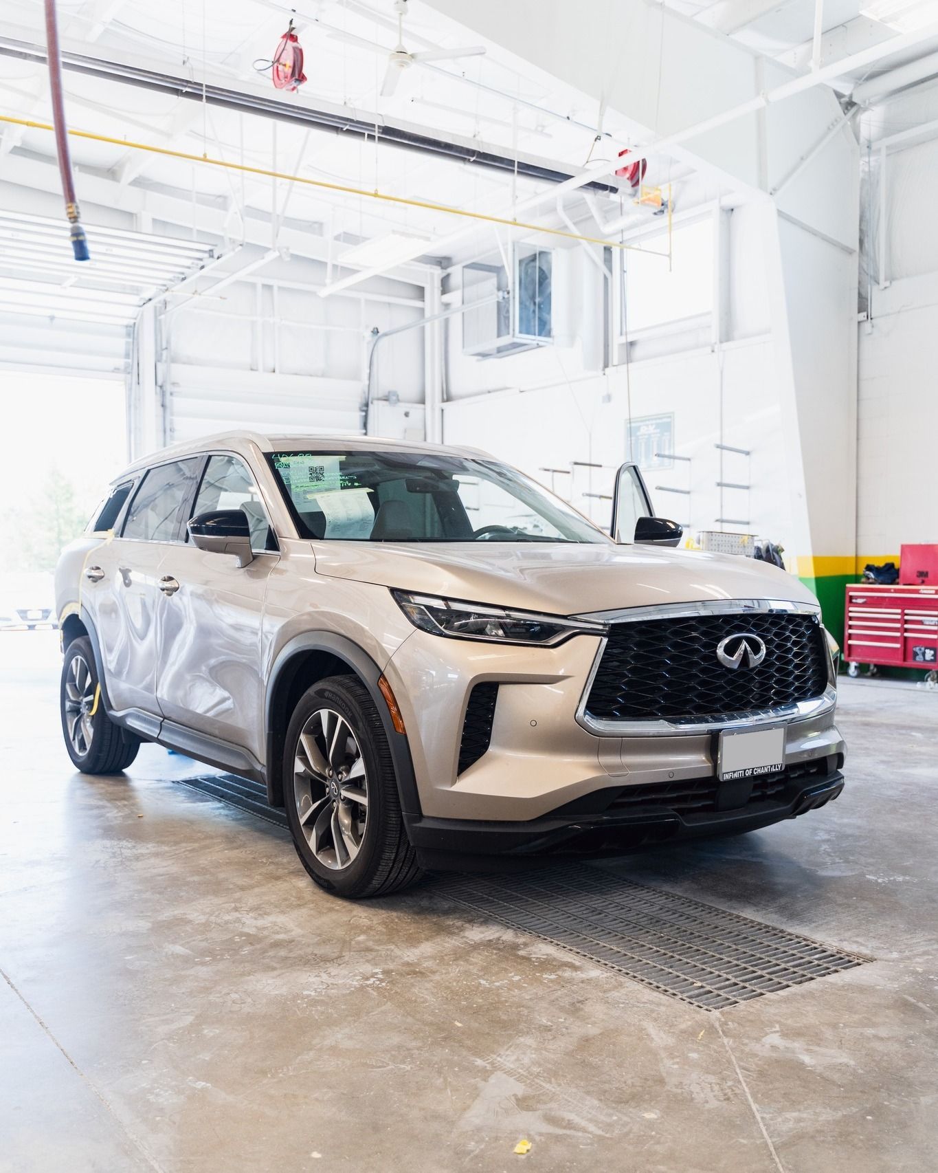 White SUV Parked Inside Auto Body Shop | D&V Autobody Overland