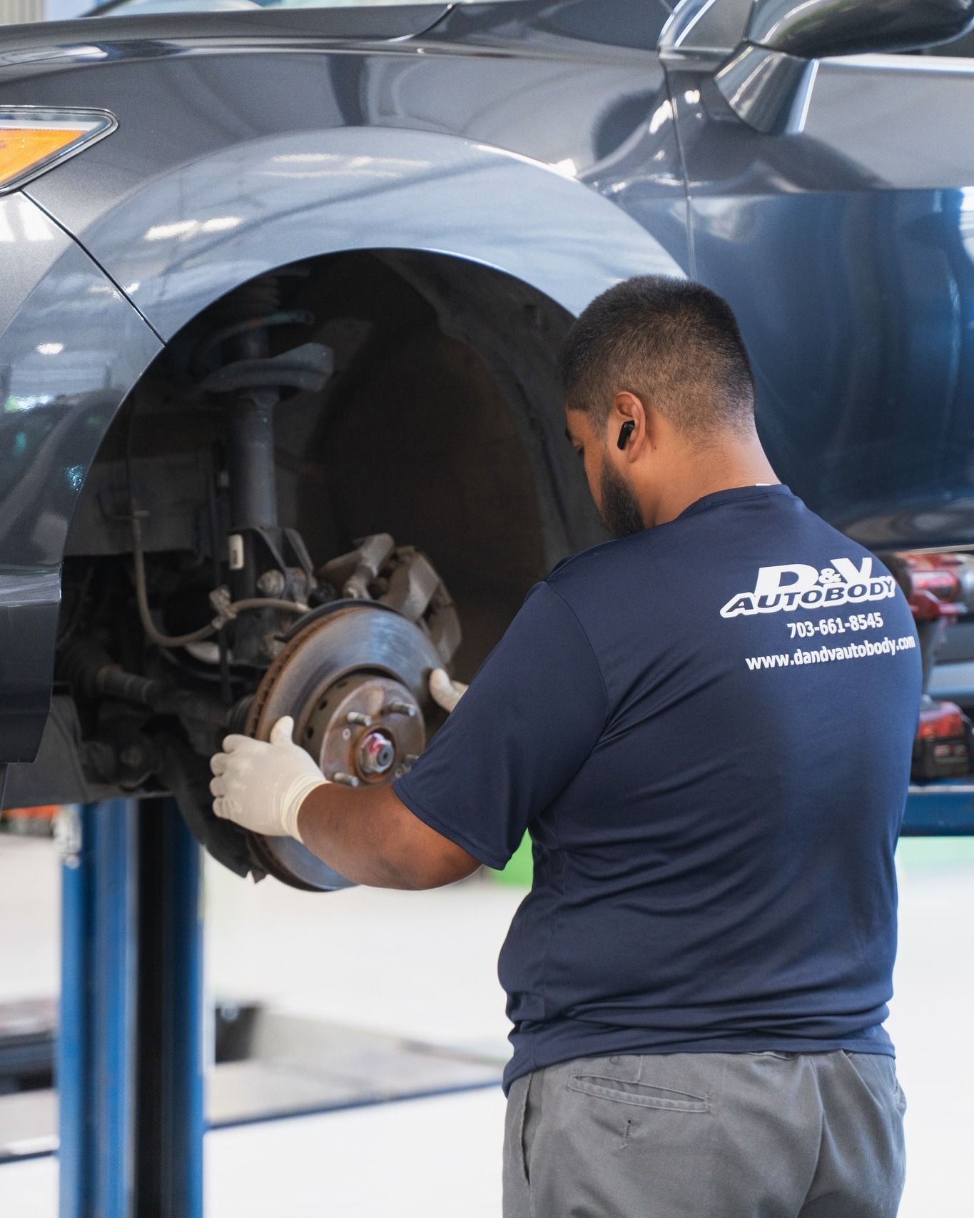 Mechanic Repairing Brake Rotor On Vehicle | D&V Autobody Overland