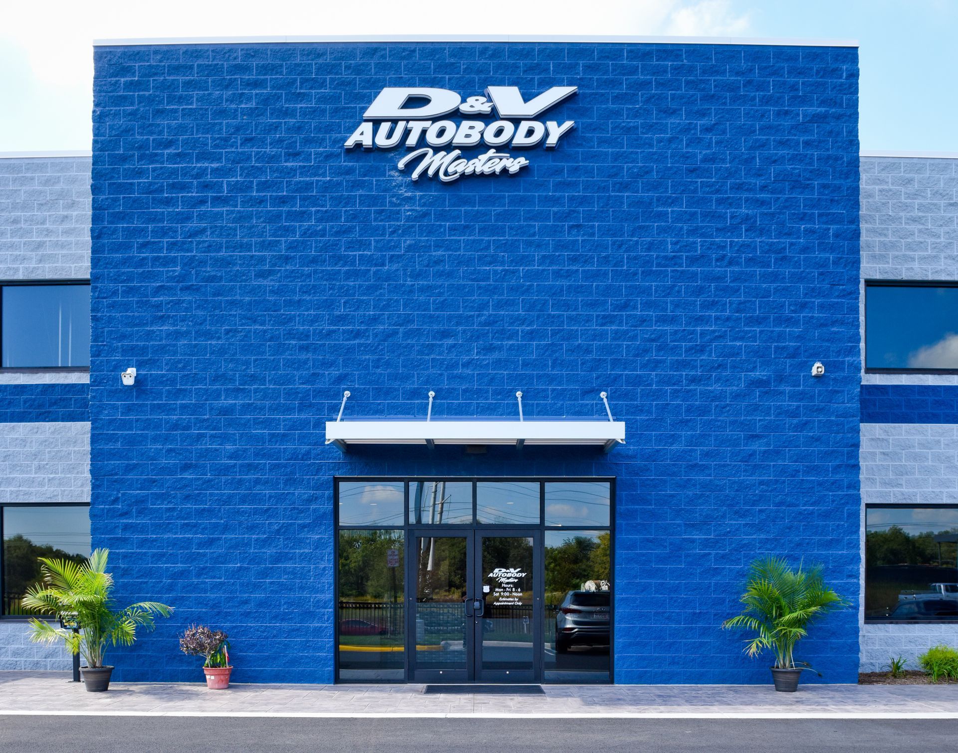 Blue Exterior Of D&V Autobody Facility With Entrance | D&V Autobody