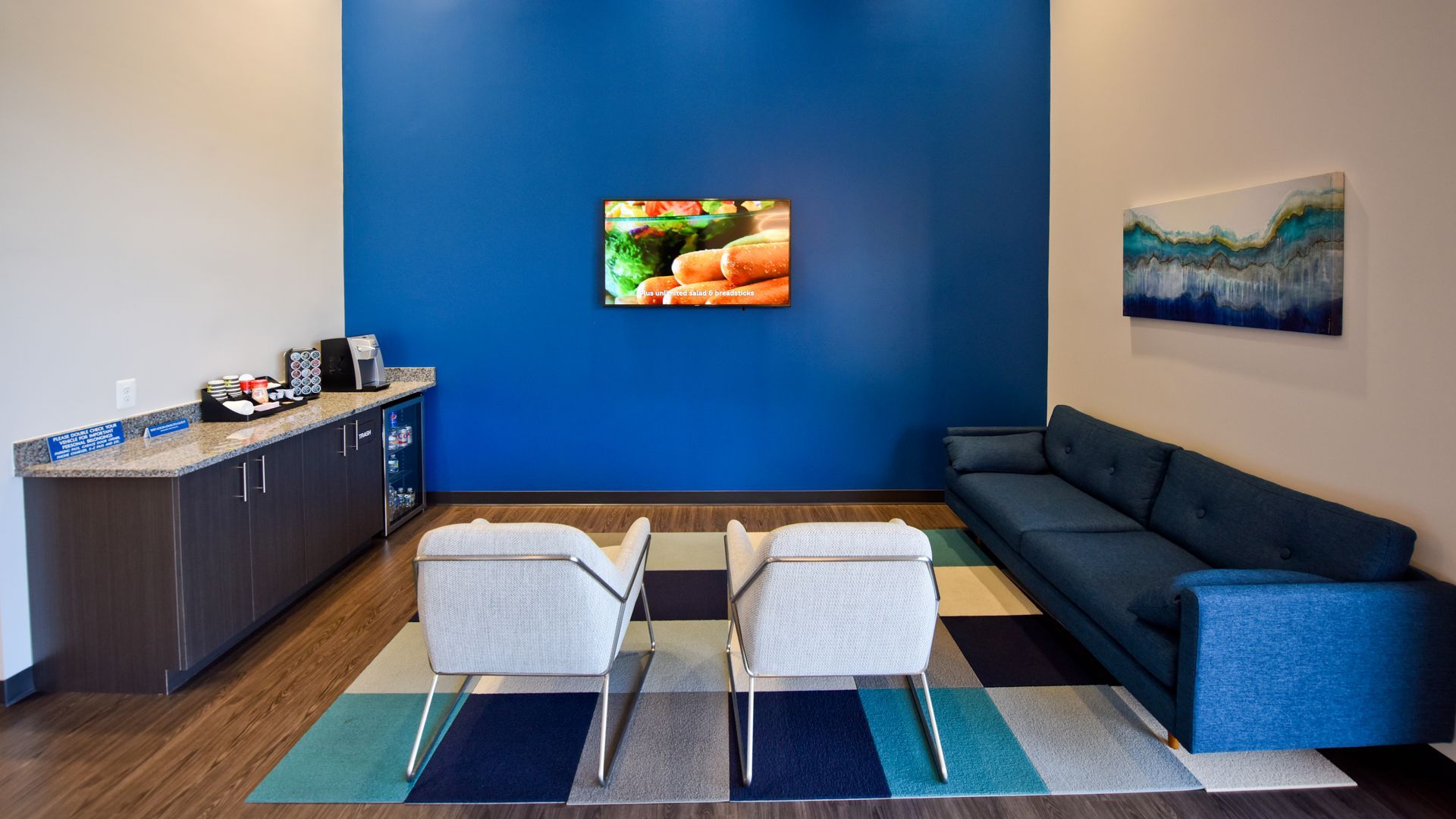 Waiting Room With Couches And Mounted TV | D&V Autobody