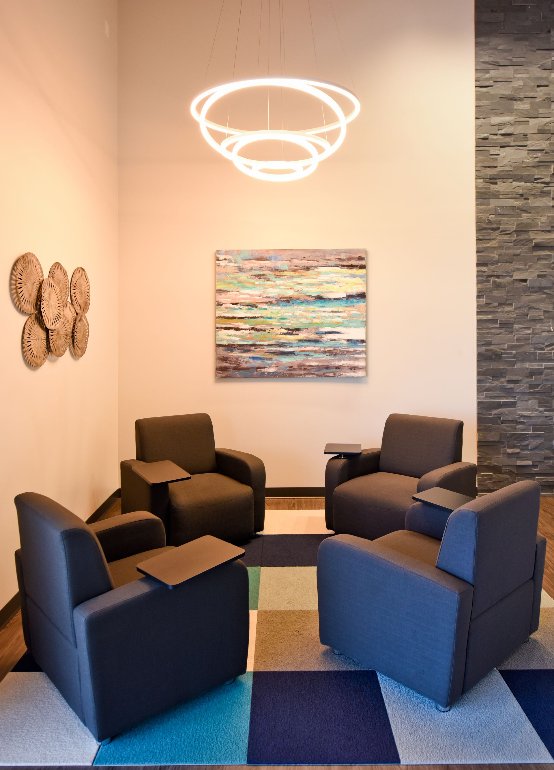 Small Waiting Area With Blue Chairs And Wall Art | D&V Autobody
