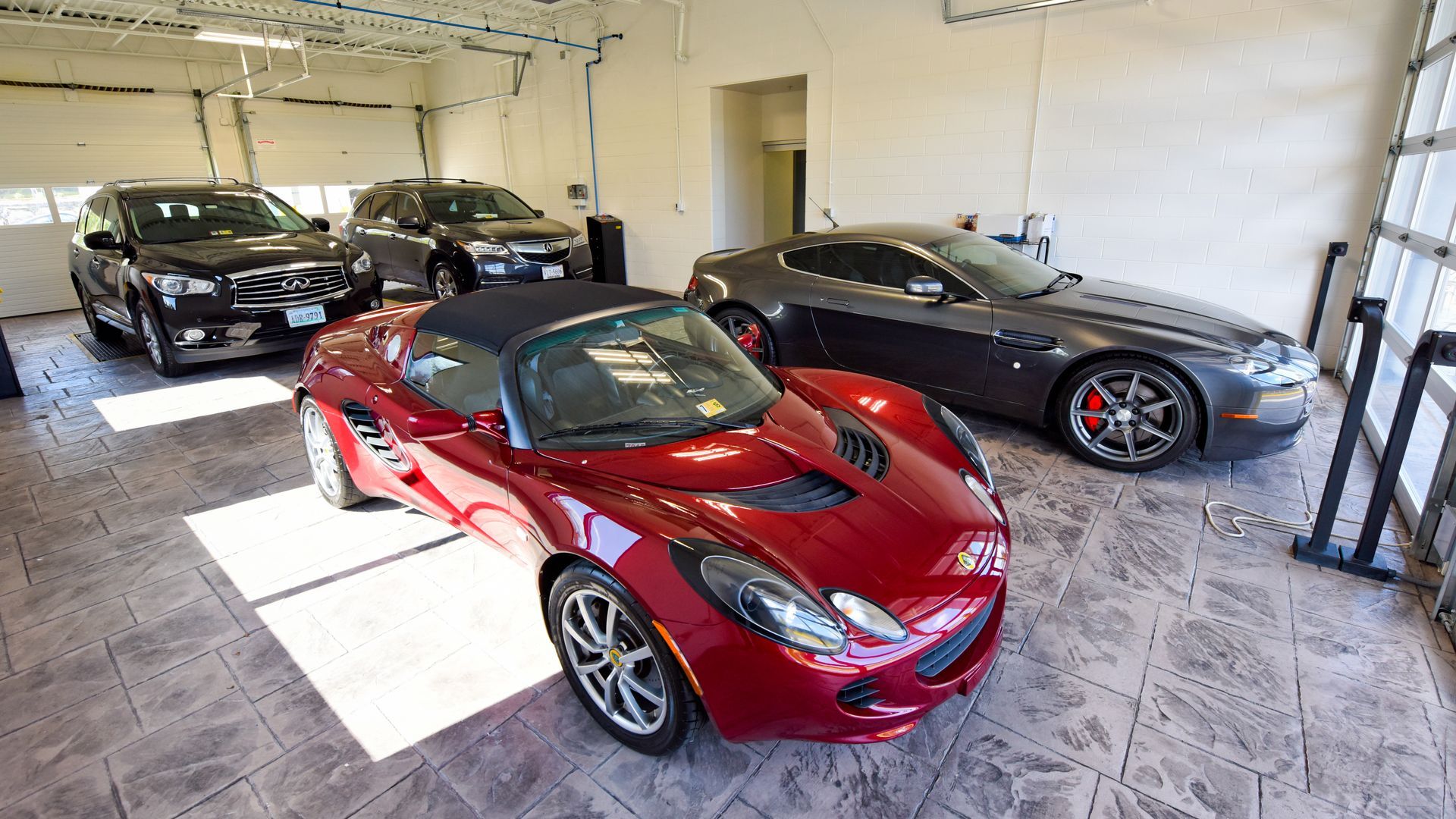 Luxury Red Sports Car Parked Inside Shop | D&V Autobody Masters