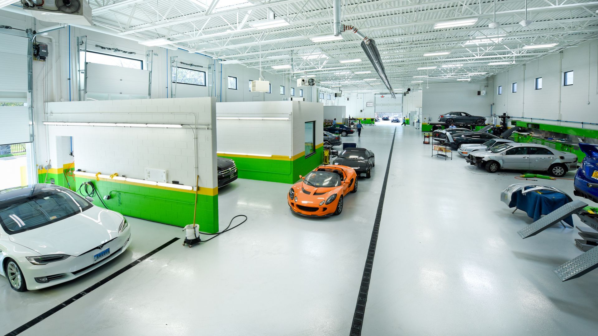 Wide View Of Auto Body Shop With Orange Car | D&V Autobody