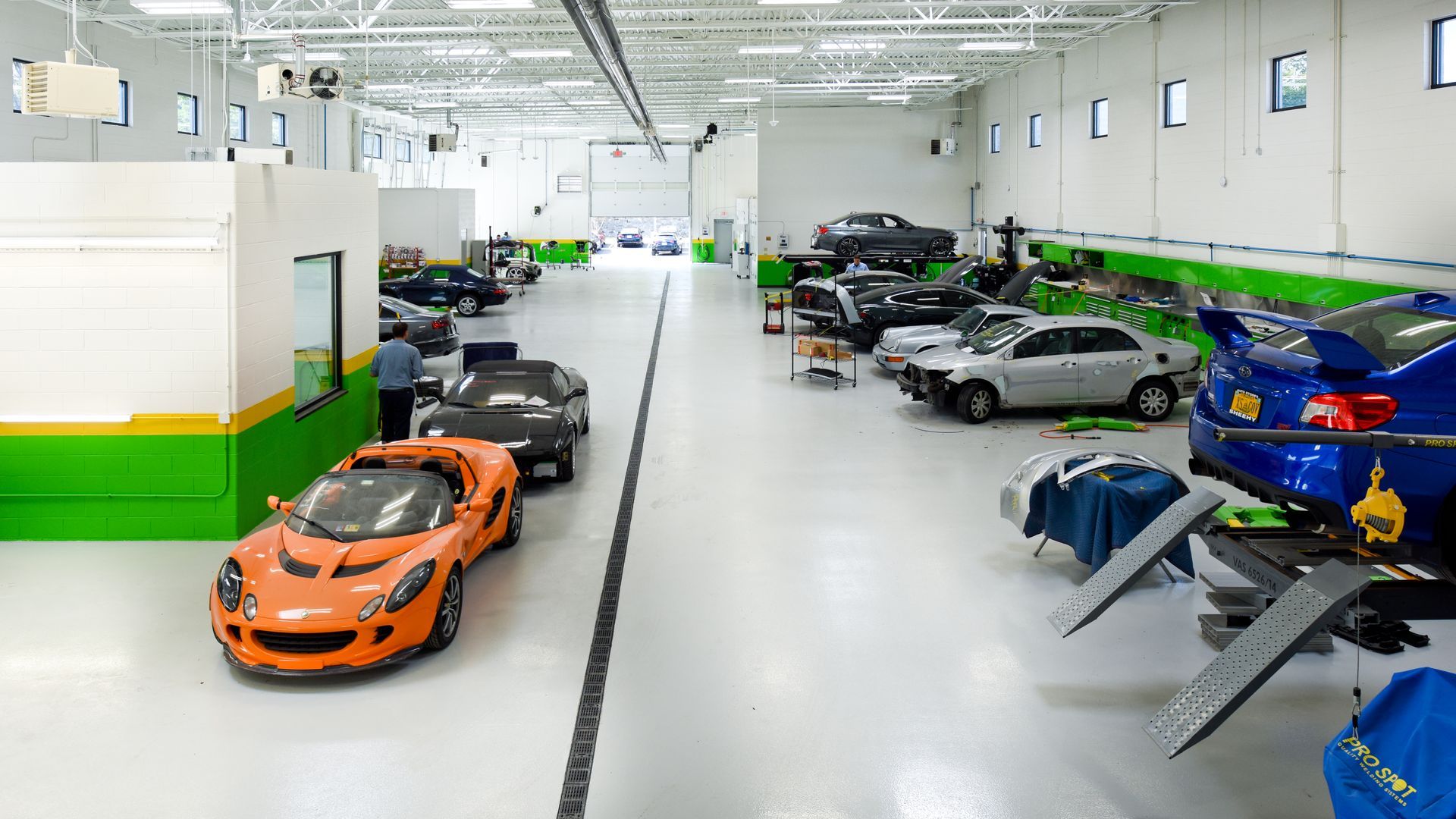 Interior Of Auto Repair Facility With Cars Parked | D&V Autobody