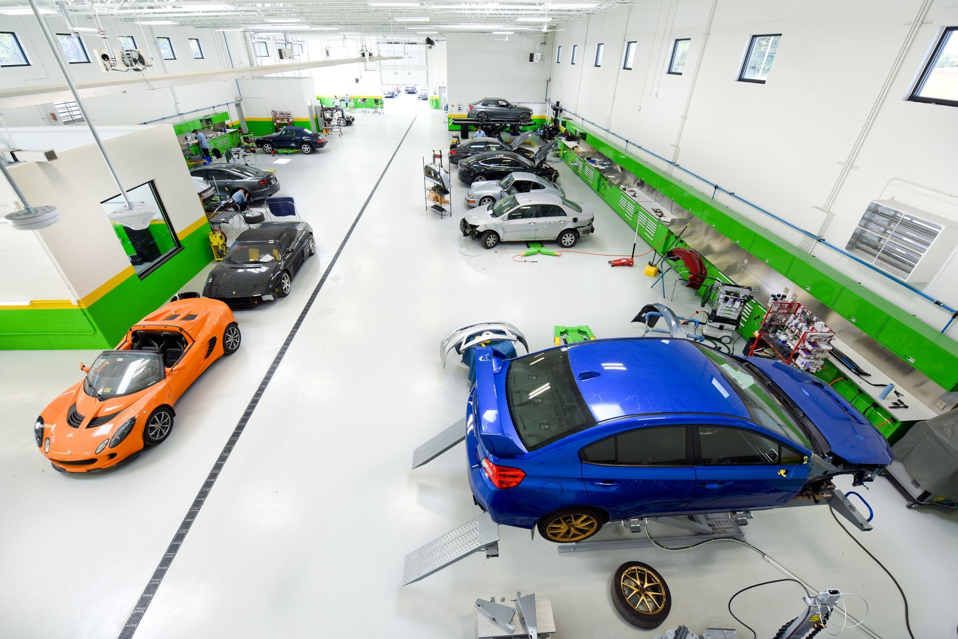 Auto Body Shop Floor With Sports Cars And Equipment | D&V Autobody