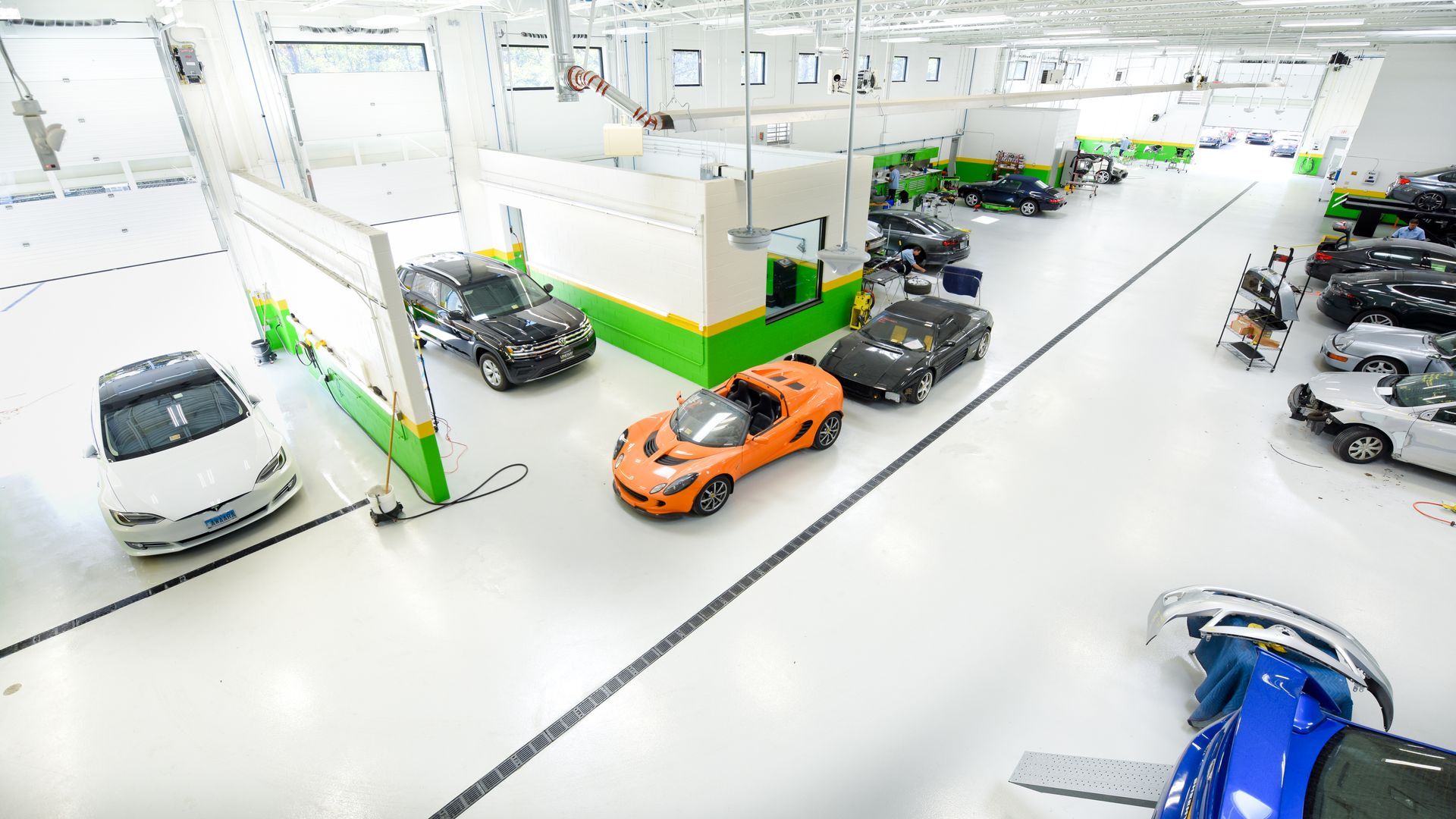 Bright Shop Interior With Multiple Vehicles | D&V Autobody