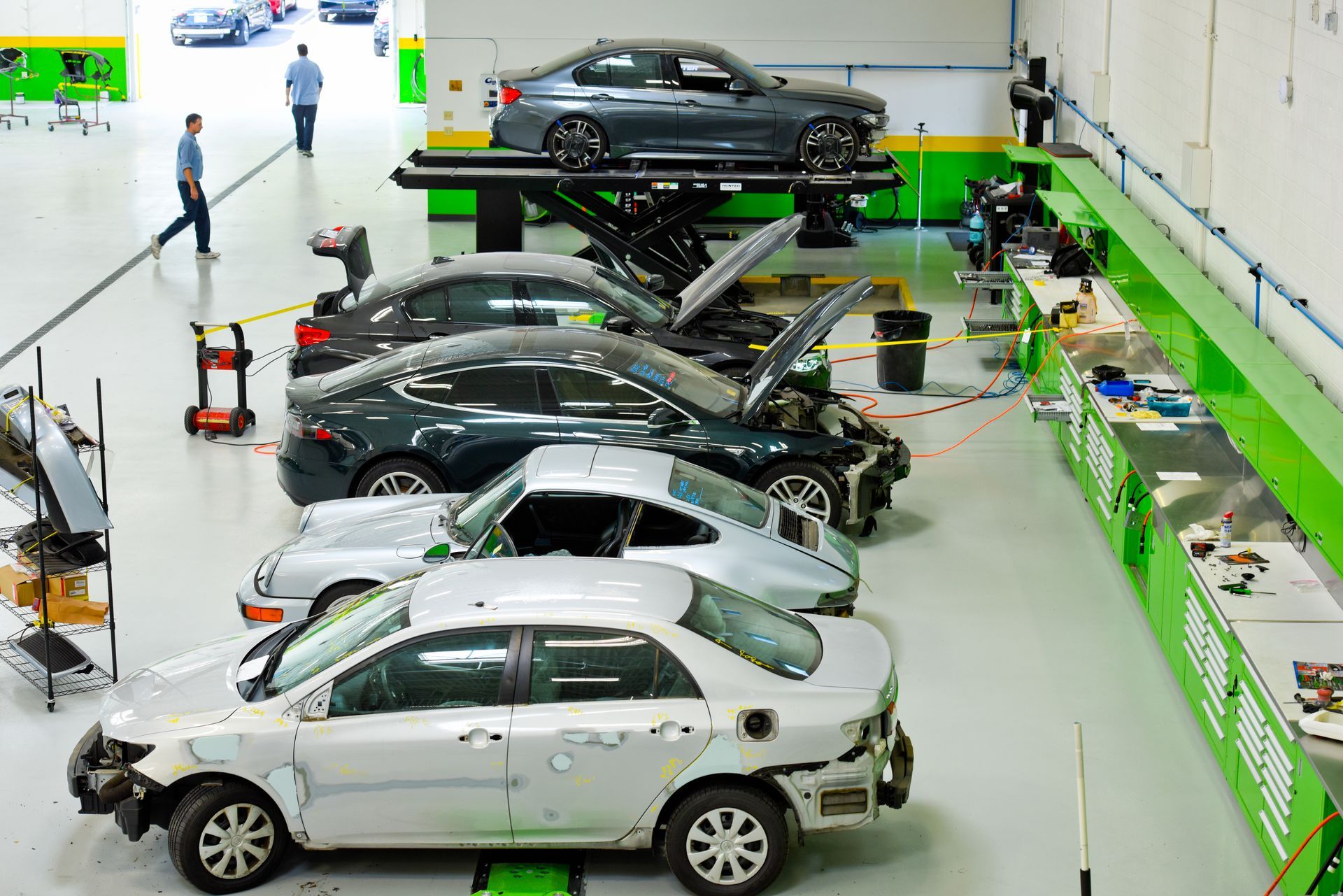 Multiple Cars Under Repair On Auto Shop Floor | D&V Autobody