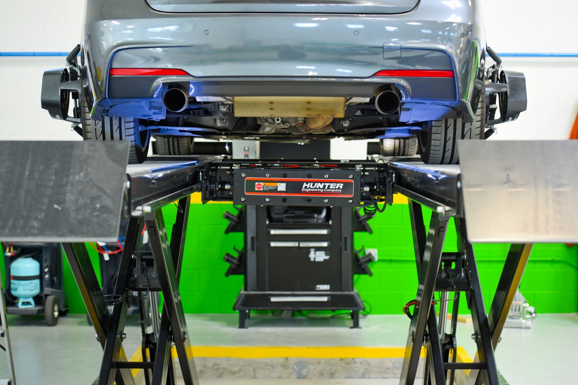 Rear View Of Car On Alignment Equipment | D&V Autobody