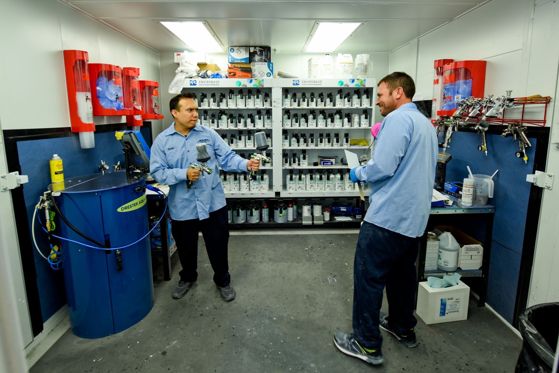 Two Technicians Talking In Paint Mixing Room | D&V Autobody