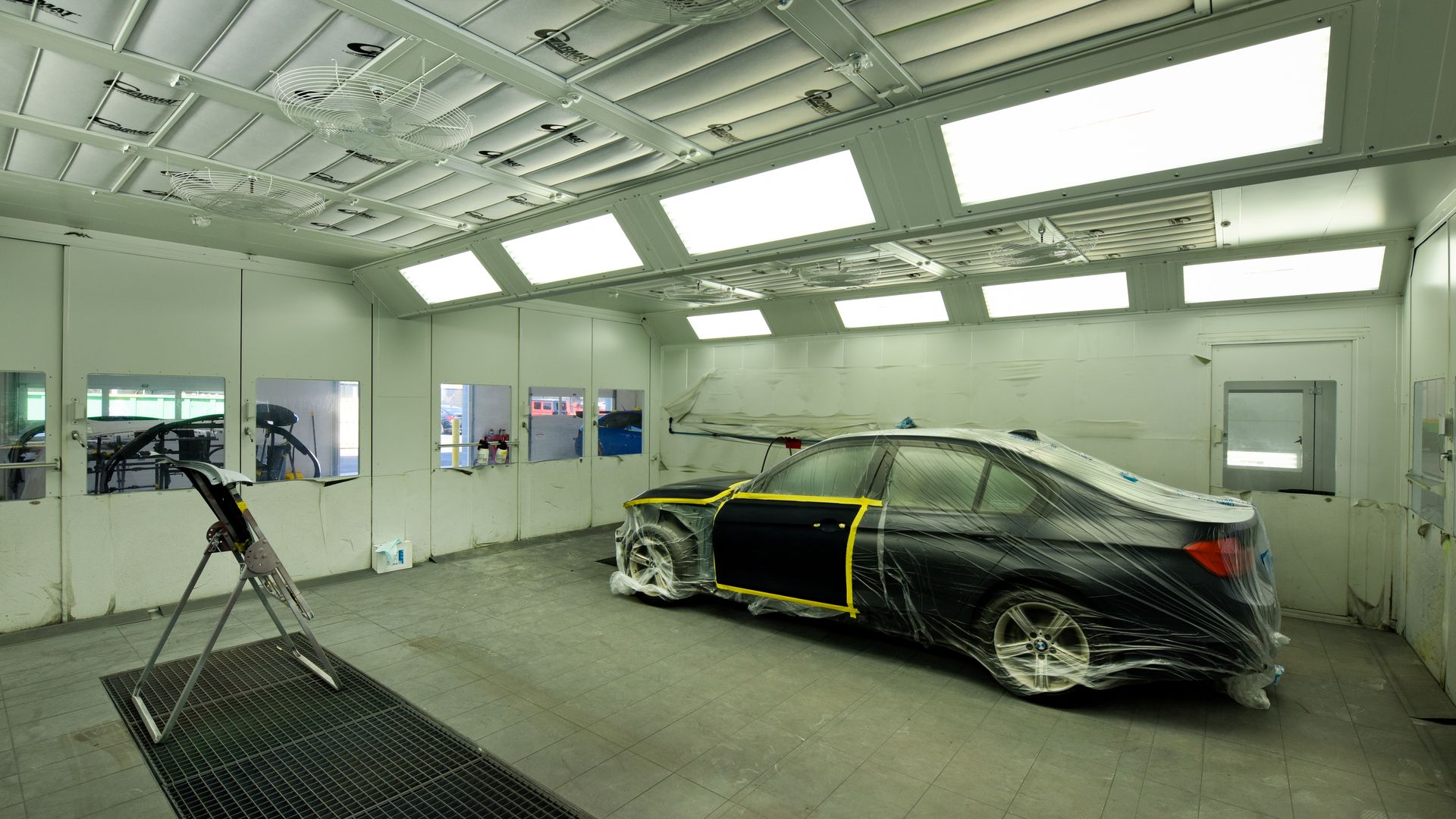 Car Positioned Inside Paint Booth For Refinish | D&V Autobody