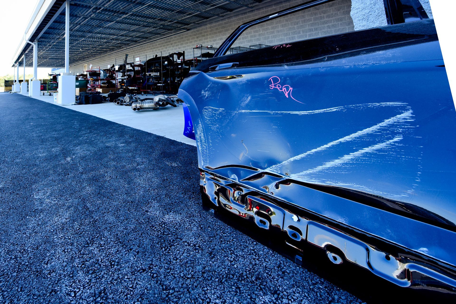 Close Up Of Blue Car With Damage On Side Panel | D&V Autobody
