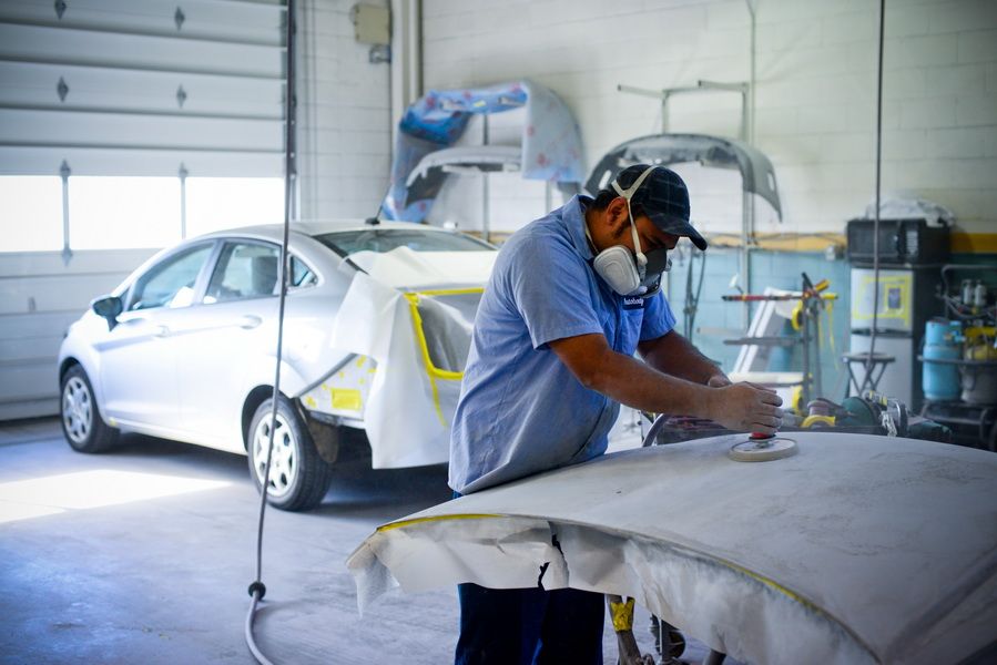 Technician Preparing Car Panel For Paint | D&V Autobody