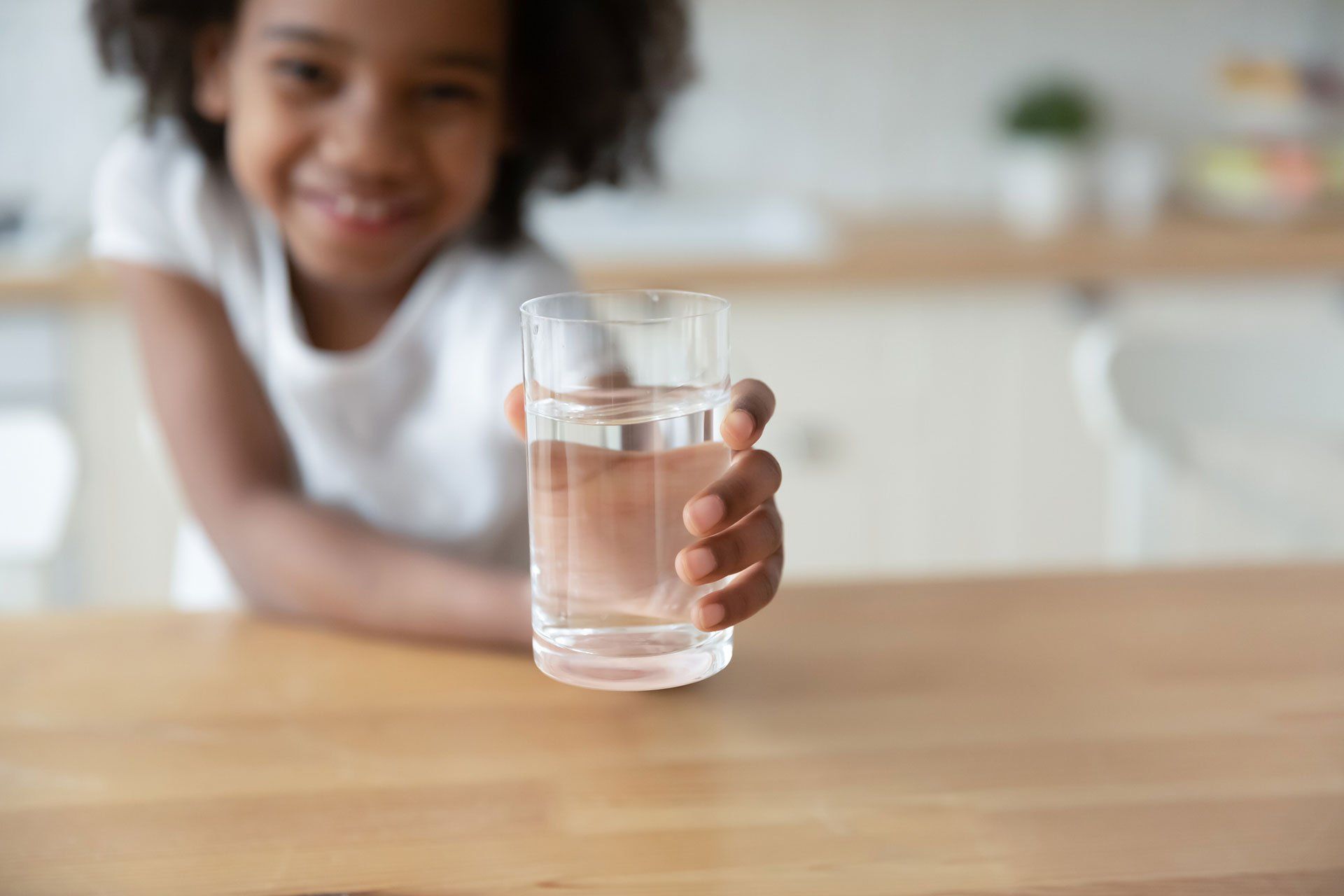 Child holding a glass of water