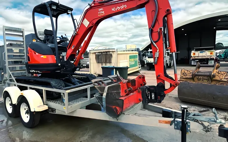 Red Kubota Excavator on a Trailer, Ready for Transport — Allquip Rentals Pty Ltd in Cooroy, QLD