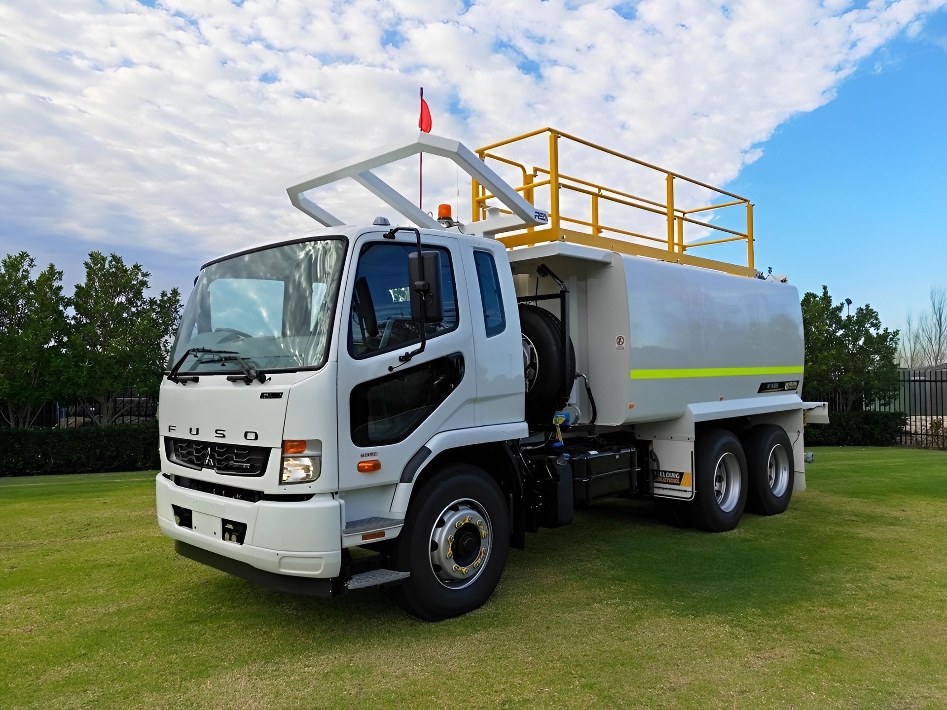 White Water Truck on Green Grass, Yellow Safety Rails — Allquip Rentals Pty Ltd in Cooroy, QLD