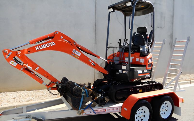 Orange Kubota Excavator on a Trailer, Ready for Transport — Allquip Rentals Pty Ltd in Cooroy, QLD